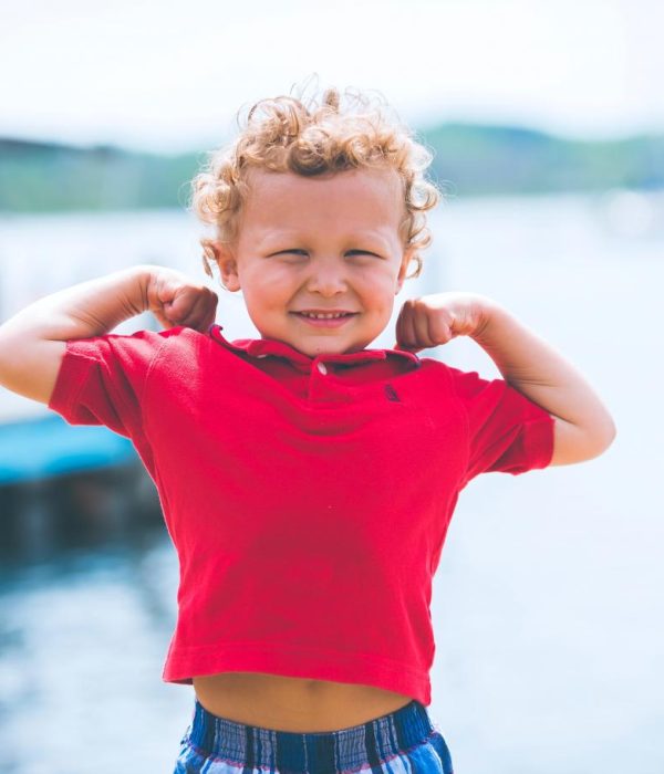 boy with strong arms up